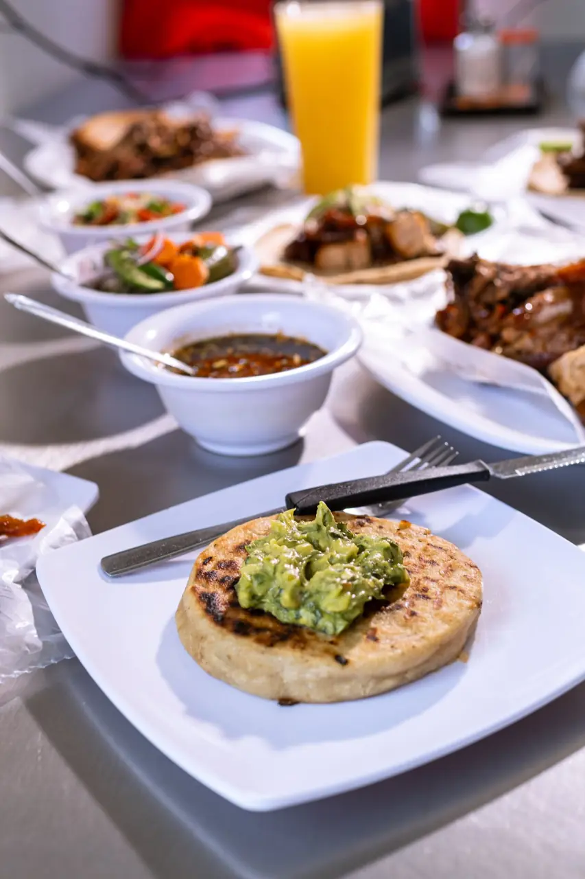 Pupusas served with curtido and salsa